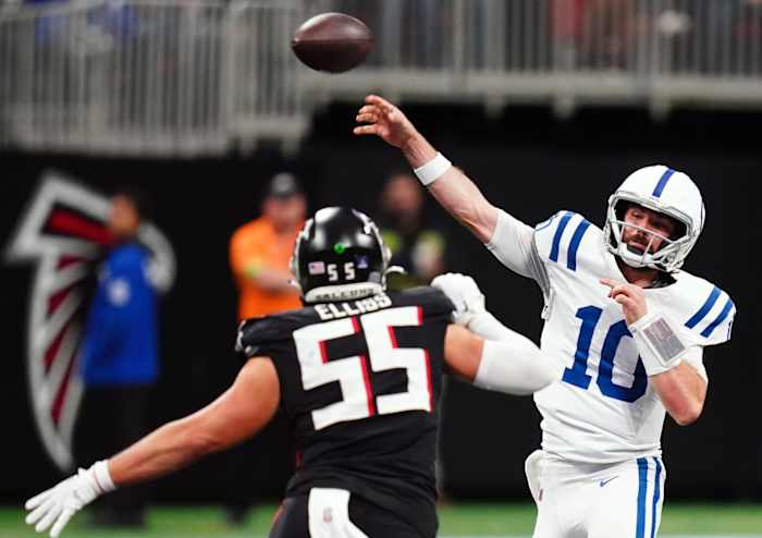 Dec 24, 2023; Atlanta, Georgia, USA; Indianapolis Colts quarterback Gardner Minshew (10) passing under pressure from Atlanta Falcons linebacker Kaden Elliss (55) during the second half at Mercedes-Benz Stadium.